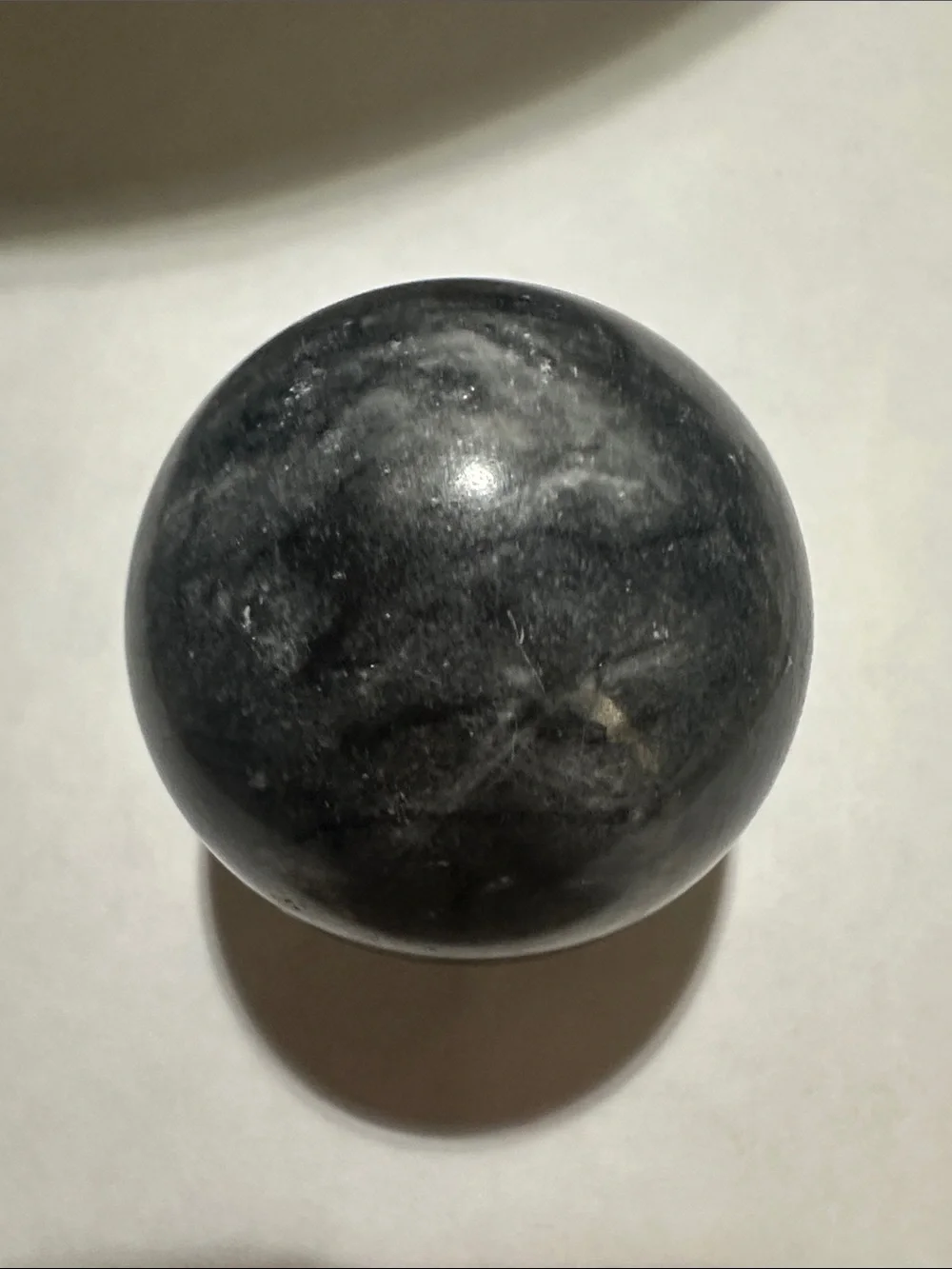 Decorative black/gray polished 2.0 inch diameter sphere.